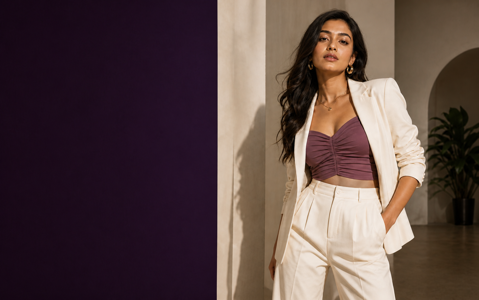 Woman in an ivory suit and dusty-plum top from Yuvashie's Western Wear direction